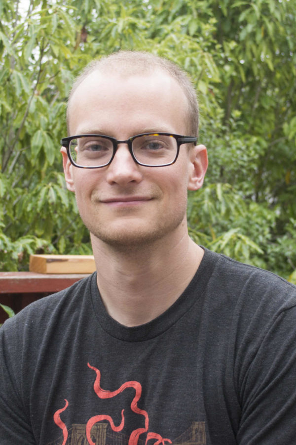 Andrew Myers seated outdoors
